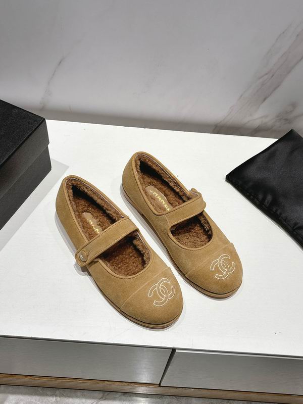 Chanel CC logo Mary Jane ballet flats in camel shearling with Velcro strap, pair displayed on white surface